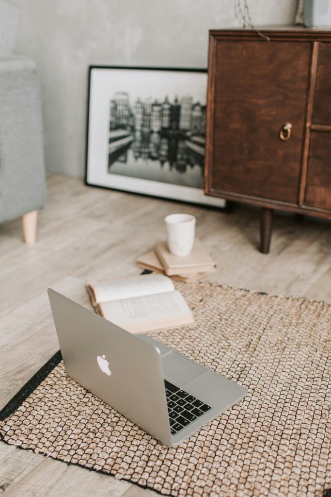 https://www.pexels.com/photo/laptop-and-books-on-floor-carpet-4050325/